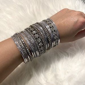 Assorted silver and white bangles